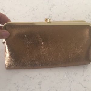 Hobo clutch purse. Gold with floral inside.